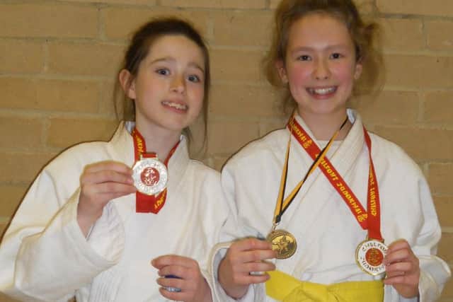 Gold medal winners Rebekah Bryant Moore (U32kg) and Maggie Rumsby Ferris (U36kg)