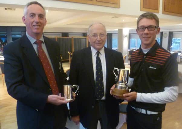 Josh Hilleard received the Berkhamsted Trophy from club captain Bob James and John Chester from tournament sponsor Mercedes-Benz. Picture (c) Ian Hall