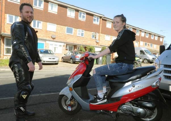 Molly Peters with Gareth Young after her scooter was repaired