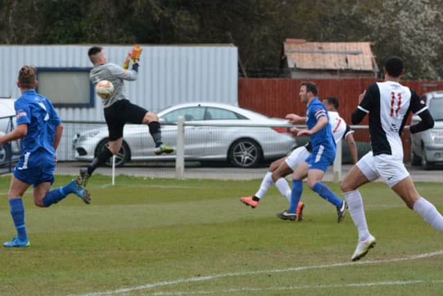 Immanuelson Duku puts the ball past the keeper to score Kings Langley's first goal. Picture (c) Chris Riddell