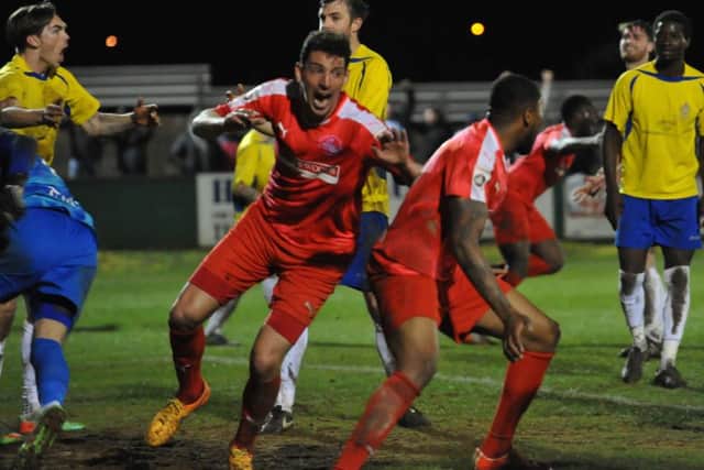 Adam Bailey-Dennis celebrates his late equaliser. Picture (c) Terry Rickeard