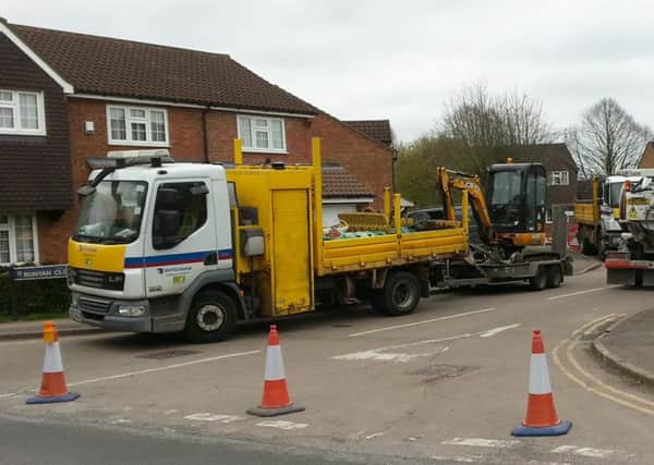 Engineers attending to the hole on Bunyan Close, Tring