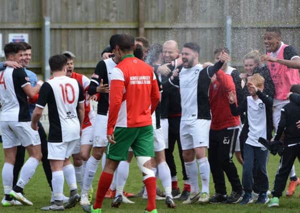 The Kings Langley players celebrate after winning the title. Picture (c) Chris Riddell