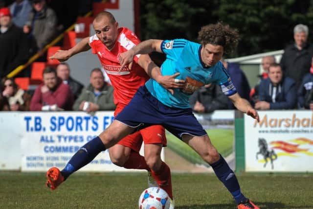 Ben Herd battles for the ball against Sergio Torres. Picture (c) Terry Rickeard