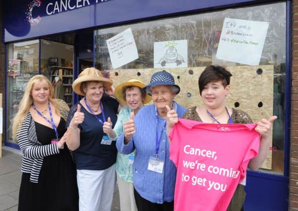 Business as usual. Staff being positive at Cancer Research UK, Hemel Hempstead.
 They are, right to left: Sophie Pomroy, Janet Liddle, Kitty Walsh, Ellen Weymouth and Theresa McDonagh