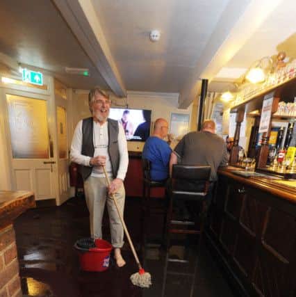 White Lion Street in Apsley looked like a canal on Monday evening.
Landlord of the White Lion, Peter O'Keife, mopping up.