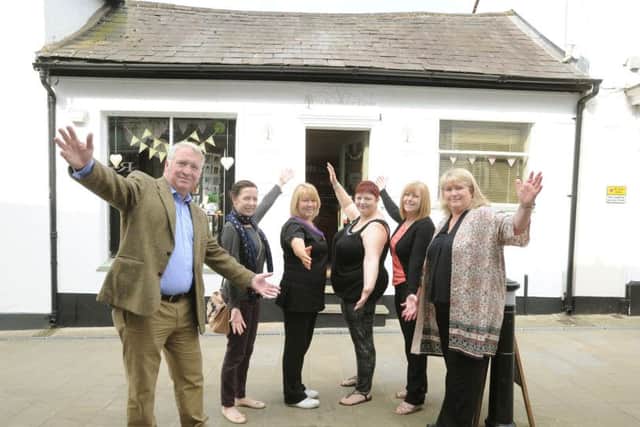 Helen Lehrle, right, with her staff and Mike Penning celebrate the moving of Acorn Wellbeing to 42 High Street, Hemel Hempstead.