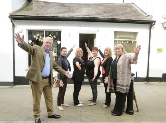 Helen Lehrle, right, with her staff and Mike Penning celebrate the moving of Acorn Wellbeing to 42 High Street, Hemel Hempstead.