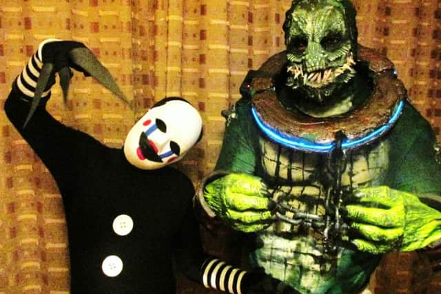 Damian Hammond, right, as Killer Croc and son Anton, 12, as The Puppet from video game Five Nights at Freddy's