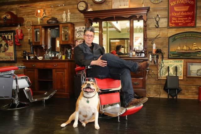 Joey McKinlay at the Gentlemen's Lounge in Bovingdon, with her Staffie Buster