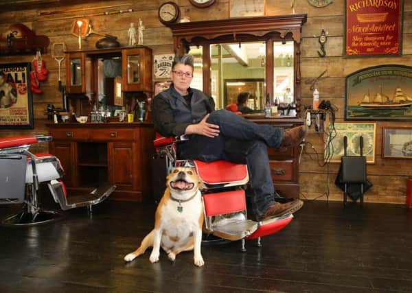Joey McKinlay at the Gentlemen's Lounge in Bovingdon, with her Staffie Buster
