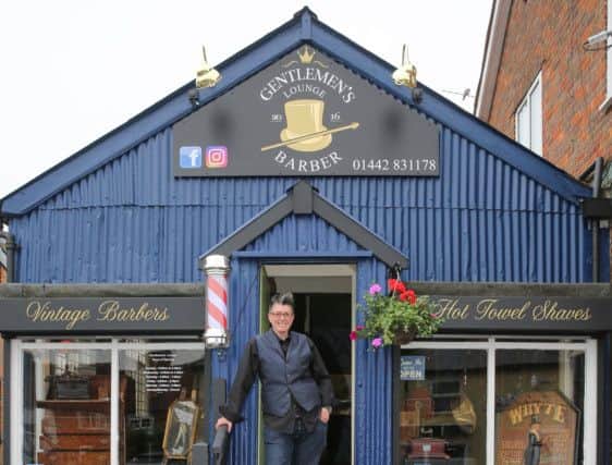 Joey McKinlay at the Gentlemen's Lounge in Bovingdon, with her Staffie Buster