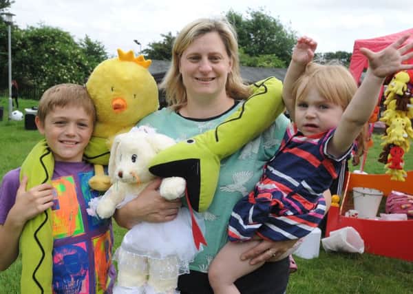 Teddy Bear's Picnic at Chaulden Adventure Playground, Hemel Hempstead on Sunday. Deniece Colley and two of her children Marshall, 10, and Aurora, one.