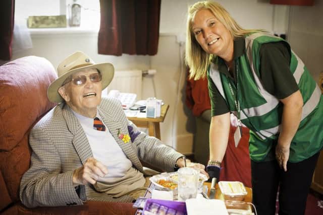 Meals on wheels customer Eddie with driver Theresa