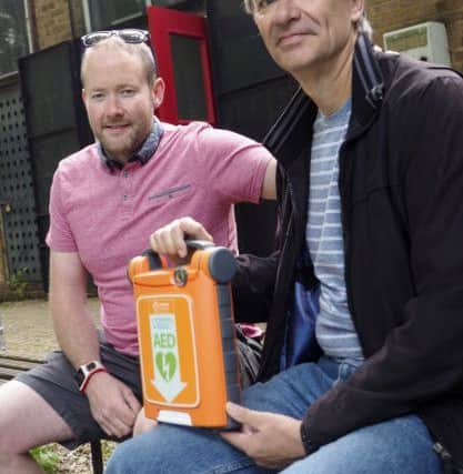 Kevin Twomey, left, with runner Nigel Ealand, who saved Kevin with the Cardiac Sciences AED at Hillingdon Athletics Club