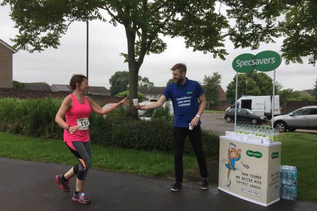 Specsavers staff hand out bottled water
