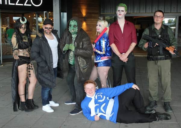Cosplayers dress up for the Suicide Squad release at Hemel Hempstead's IMAX cinema on Friday, August 5. From left: Kit Horsley as Enchantress, Kurt Gooch as El Diablo, Damian Hammond as Killer Croc, Izzi Winters as Harley Quinn, Karl Brunton as the Joker, Luke Smith as Rick Flag and Shane Considine as Cpt Boomerang, front