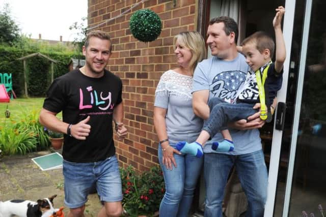 James Dodd, seven, mum Angela Barton and dad Iain Dodd with family friend Neil Harper, in black.
 James' dog is called Douglas.