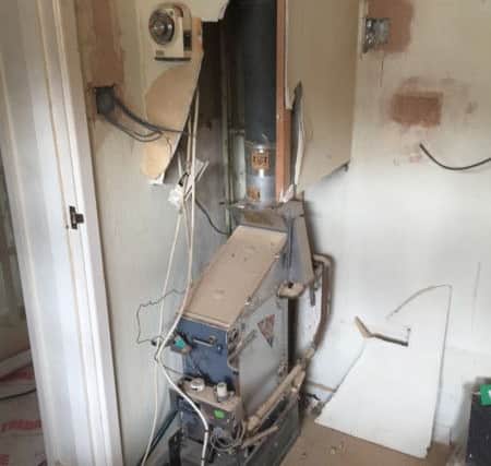 The damaged asbestos boiler at the Pursers' property in Kingsland Road, Boxmoor