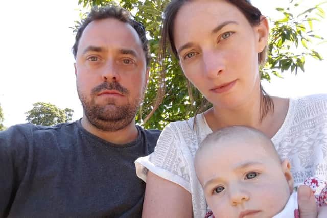 Teacher Ashley Purser, left, and wife Kate with their baby daughter Margot