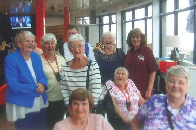 Pensioners enjoy a day at the seaside