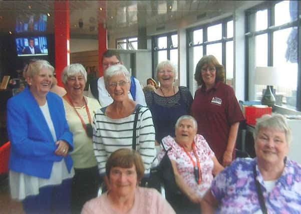 Pensioners enjoy a day at the seaside