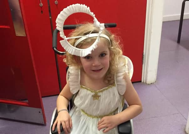 Kallie Martindale, dressed as an angel for her school nativity