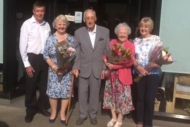 Les (centre) and Una (pink) with family and friends