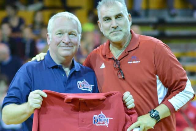 Hemel MP Mike Penning presents USA-select Coach Nick Melissaris with a Storm coaching shirt.