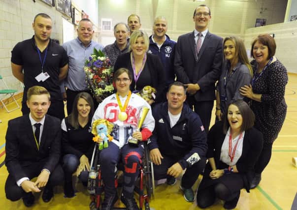 Jess Stretton at morning assembly at Longdean School, Hemel Hempstead.
With some of the people who helped her.