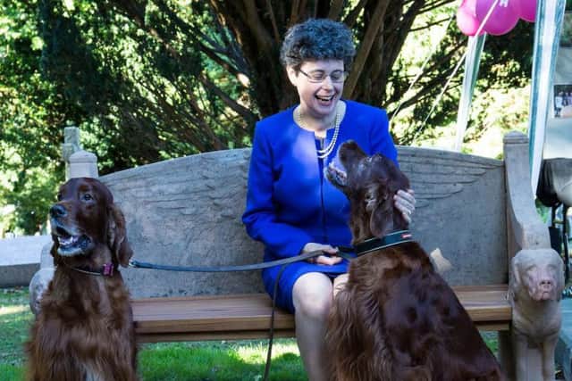 Professor Sarah Foot, with Ralph and Henry, sat on her great-grandfathers bench