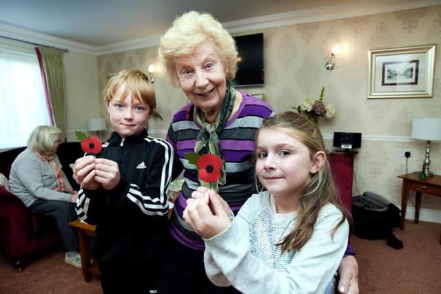 Churchill Retirement - Berkhamsted
Remembrance Day Event 11/11/16

St Thomas More School children visit the residents at Sheldon Lodge to remember the fallen from the world wars and plant crocuses in the gardens.

L-R, Sebastian McDonough, 6, Resident June Williamson, and Ellouise Adams, 6. PNL-161117-172330001