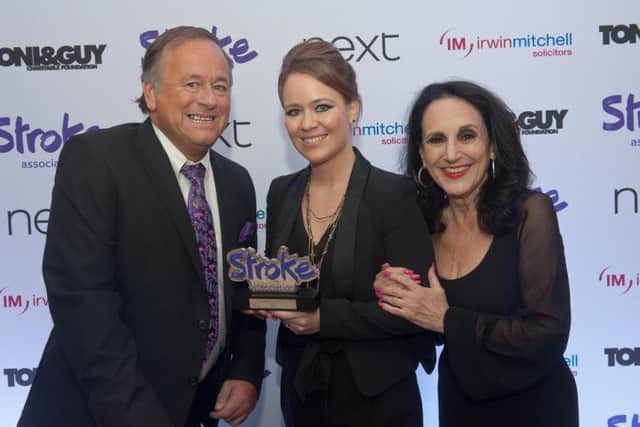 Actress Lesley Joseph (right) hands over the award