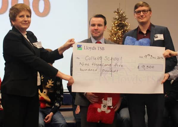 Hightown staff with their cheque for The Collett School