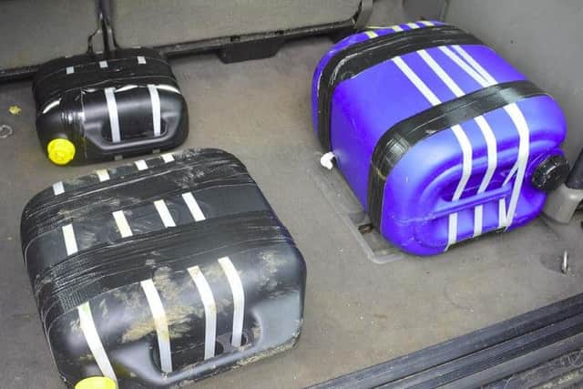 Drums of drugs found in the back of the vehicle