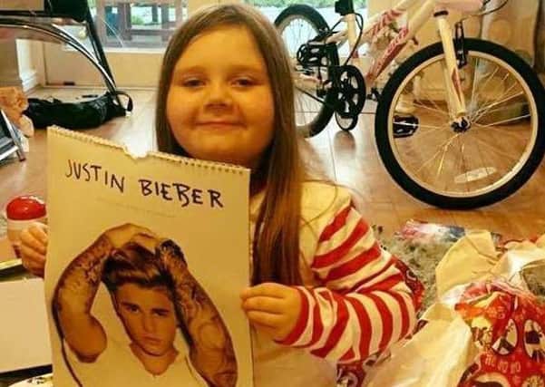 Zara Witherall with her Justin Bieber calendar