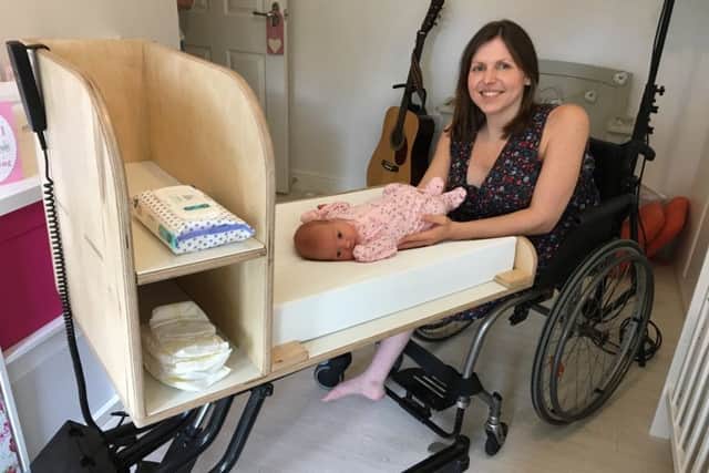 Laura and baby Evie with the changing unit
