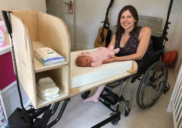 Laura and baby Evie with the changing unit