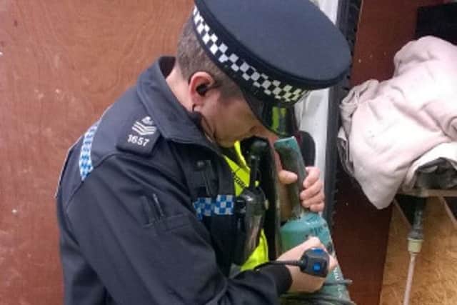 A police officer uses the new engraver