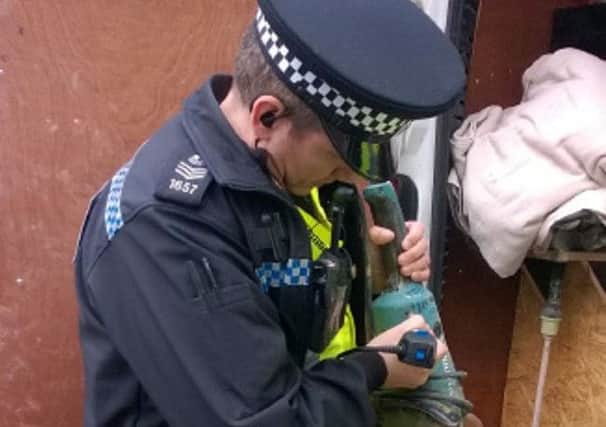 A police officer uses the new engraver