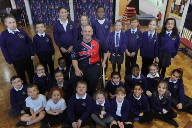 Luke Delahunty with the school council members of Yewtree Primary School on Friday