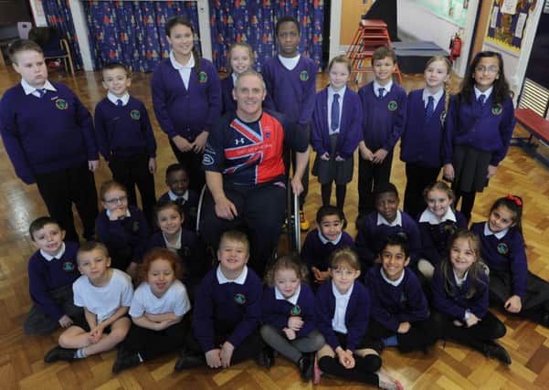 Luke Delahunty with the school council members of Yewtree Primary School on Friday