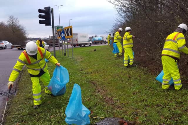 Council workers clear rubbish from the A41 in Dacorum