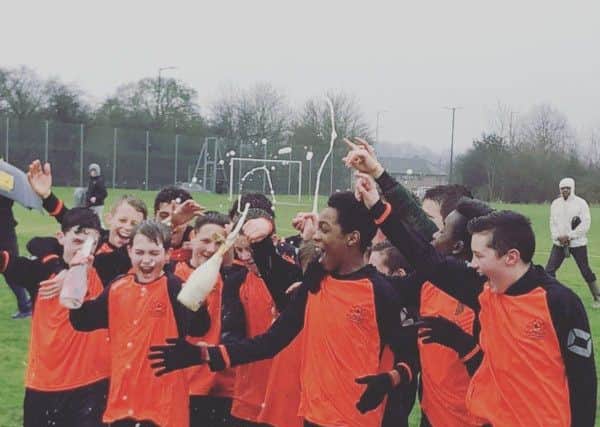 Echoes celebrate winning the league with Champers (non-alcoholic!)