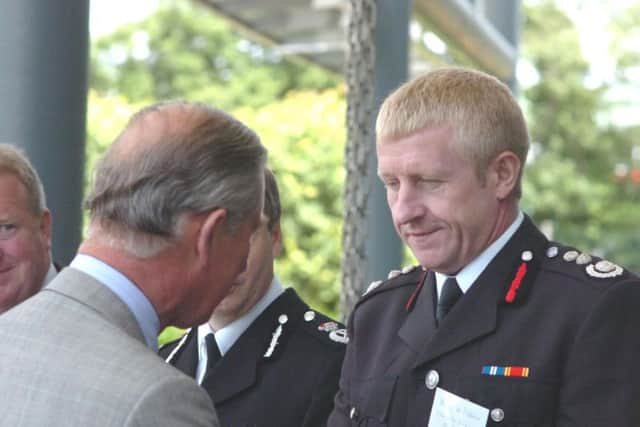 Roy Wilsher meets HRH Prince Charles shortly after the fire