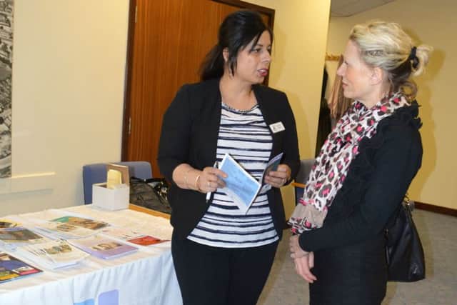 Carers support advisor Calvinder Mandair talks to a carer