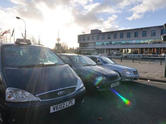 Residents have been urged to use 'local' cabs by taxi drivers