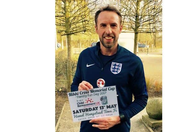 Gareth Southgate shows his support with the event poster