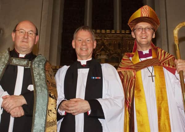 Archdeacon Jonathan Smith, new rector Reverend John Williams, and Bishop Dr Michael Beasley at the ceremony