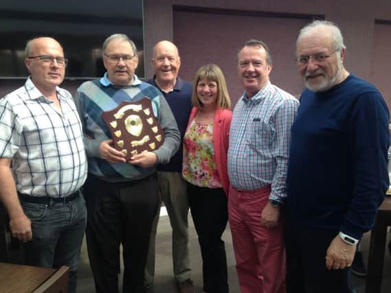 The Peter Betts Charity Shield 2017 is presented at Little Hay Golf Club to the winning team of Paul Whiter, Tony Hodson, Neil Salisbury and Robin Rose, by Mr Betts son Philip, first left, and daughter Janet.